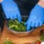 Food Safety Level 2 online course: gloved hands preparing a fresh salad