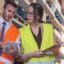Health and Safety Level 2 online course: two warehouse workers in hi-vis vests checking a tablet